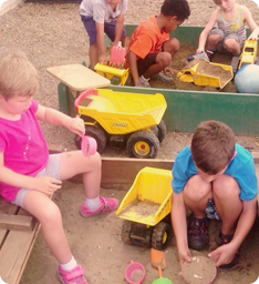kids playing in sand: Kendal Early learning Center